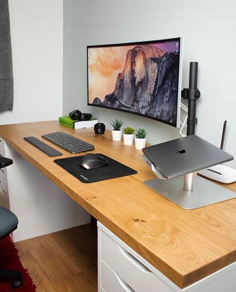 This image shows a desk for multiple screens.
