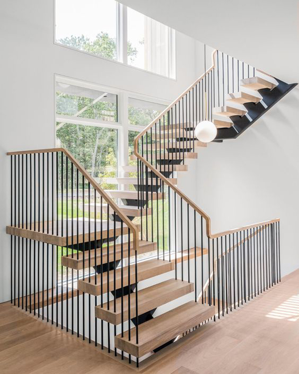 DIY staircase handrail with vertical black tubes